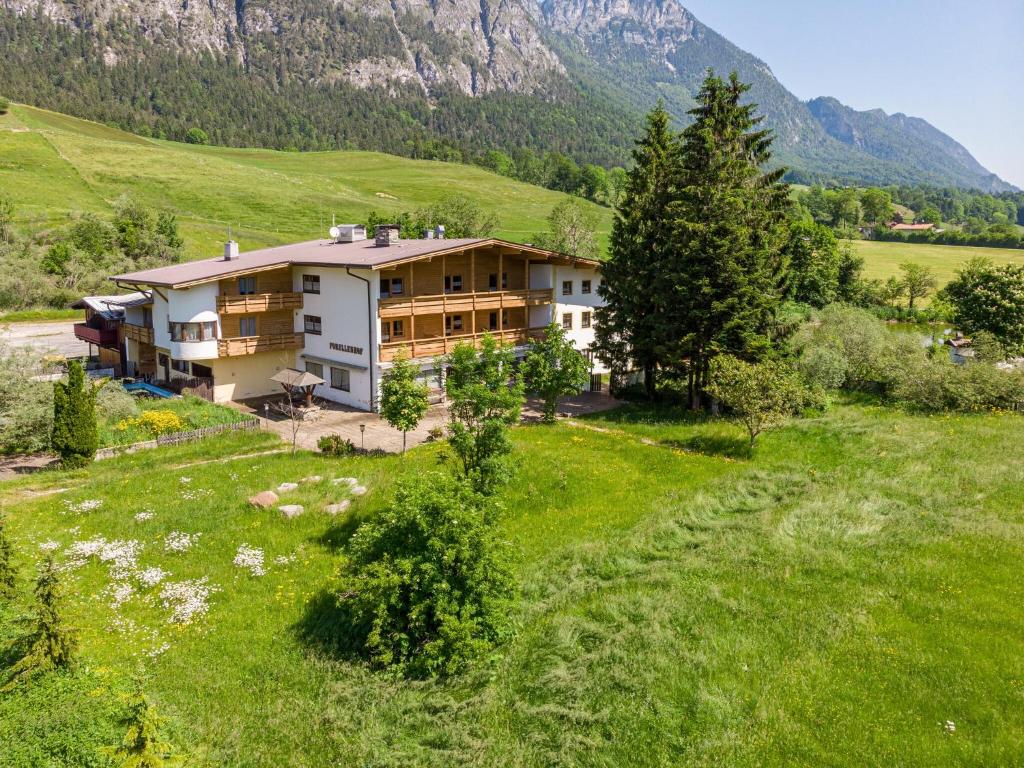 The chalet nestled below the Austrian Alps