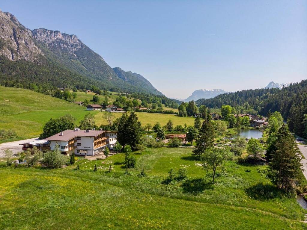 Aerial view of the chalet and valley.
