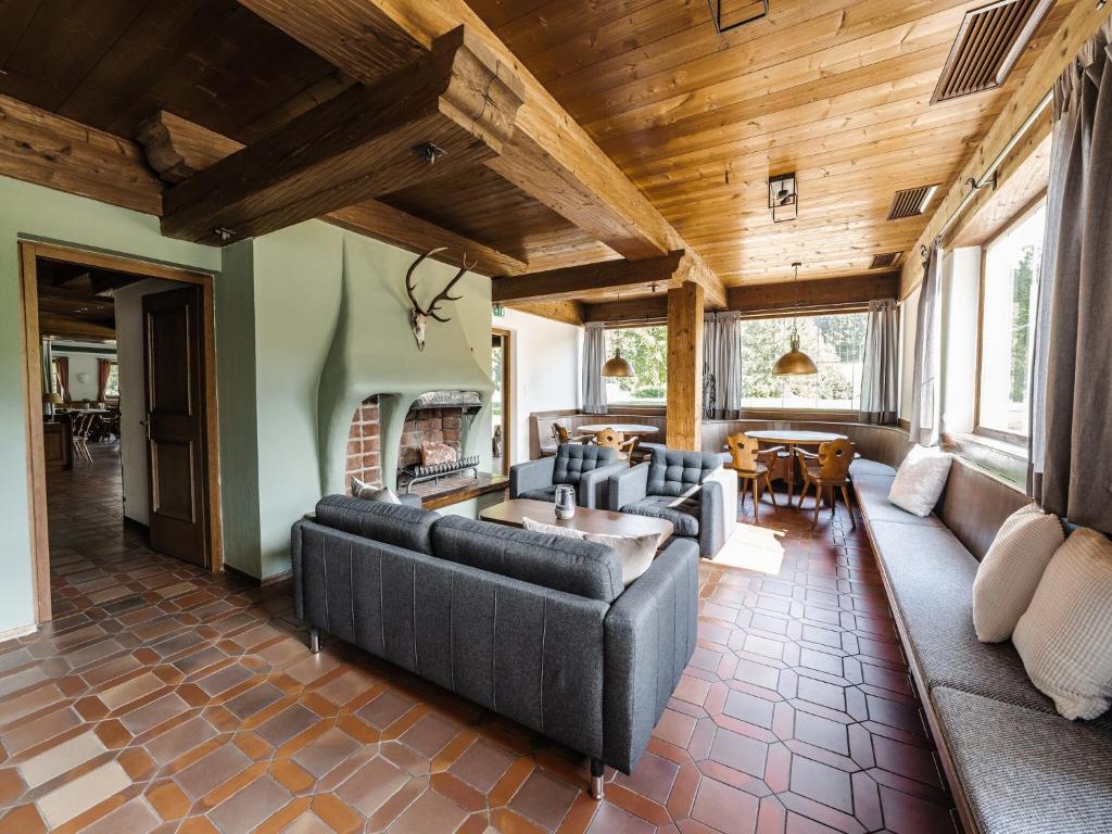 Warm wooden interior with fireplace and gathering space