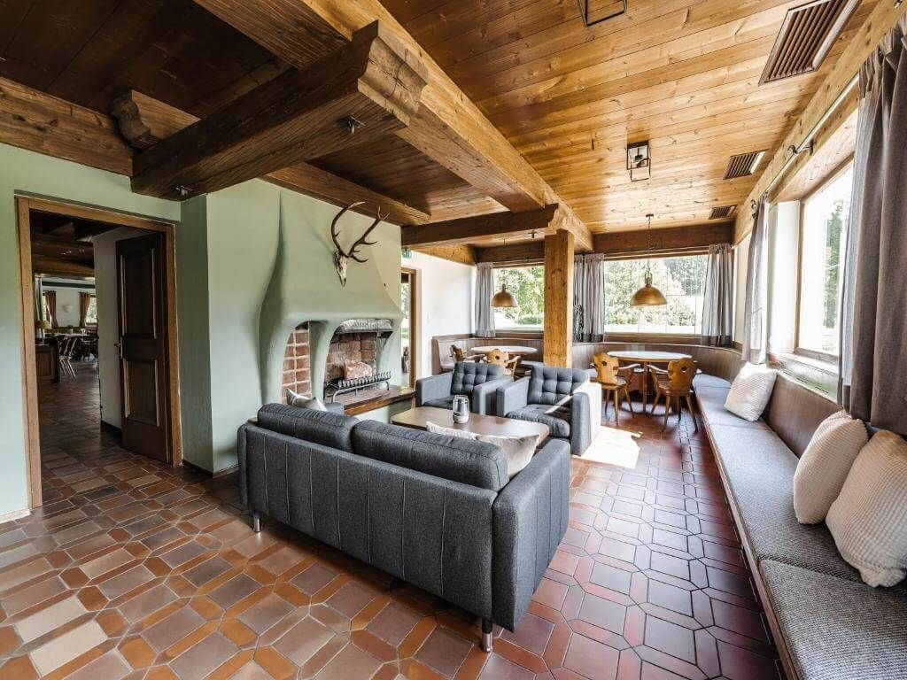 Warm wooden interior with a fireplace.